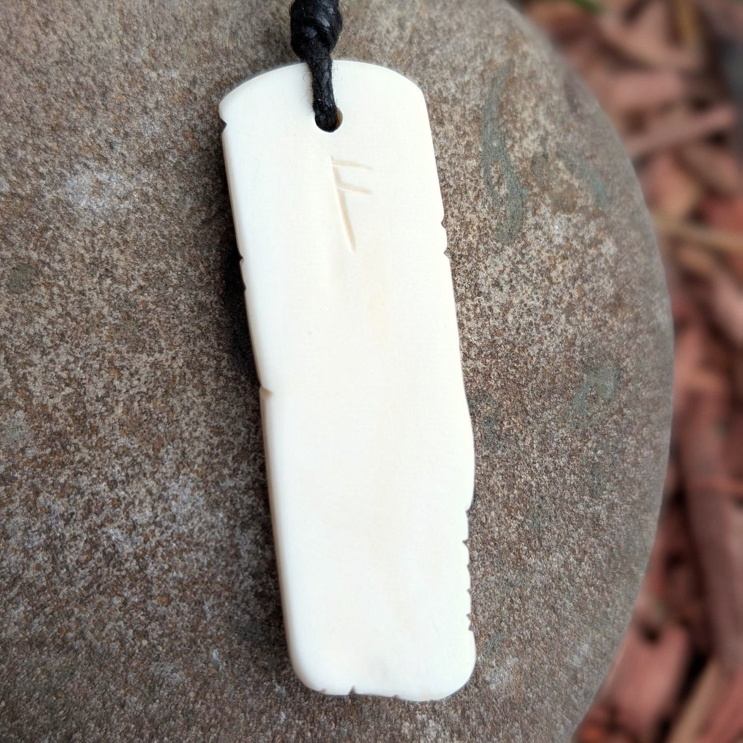 Norse Wolf Bone Pendant with Ansuz Rune, Hand-Carved Amulet
