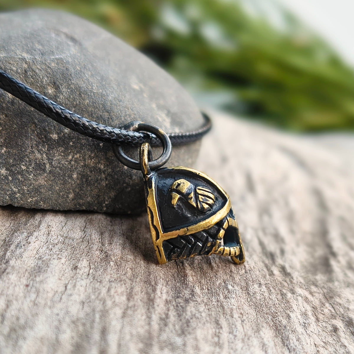 Hand-cast brass Viking helmet pendant featuring two ravens,  inspired by Norse mythology.