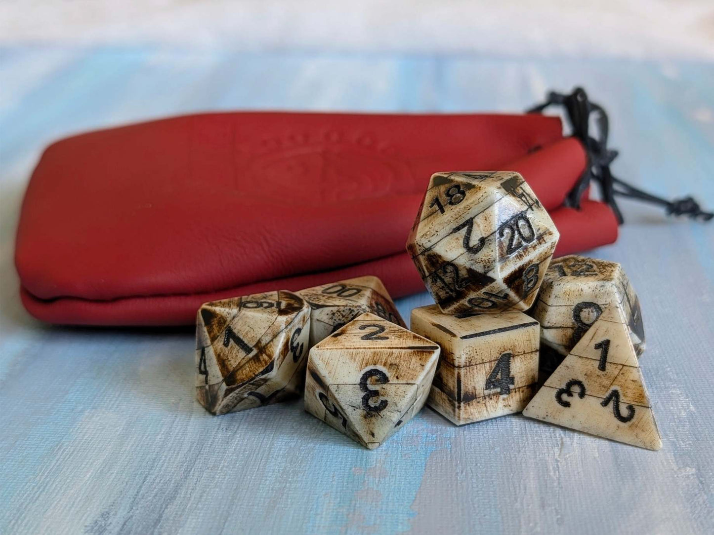 Hand-Carved DnD avDice Set in Patinated Bone with Leather Bag – Natural RPG Dice
