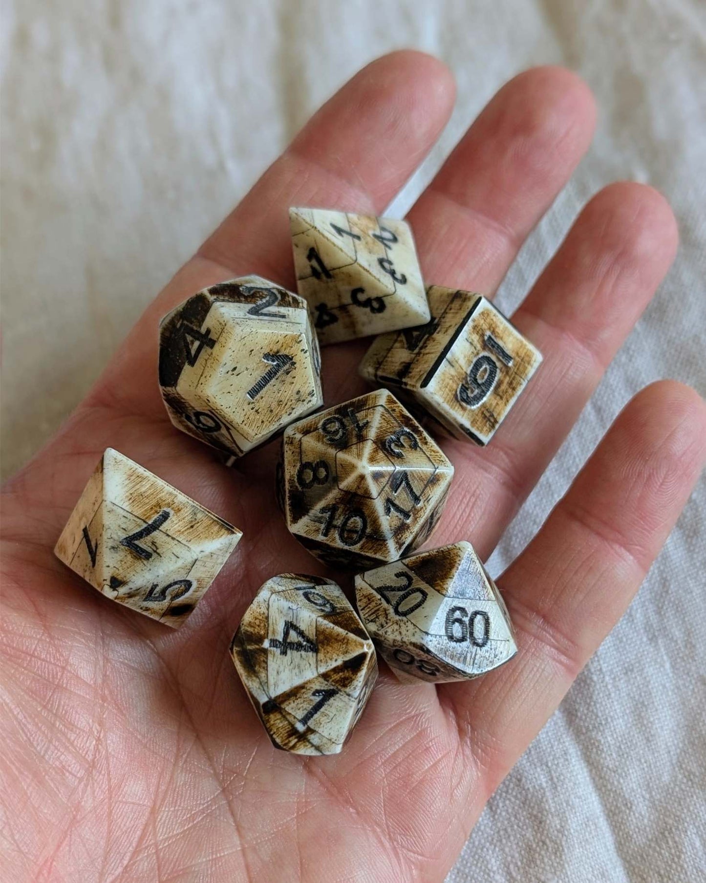 Hand-Carved DnD avDice Set in Patinated Bone with Leather Bag – Natural RPG Dice